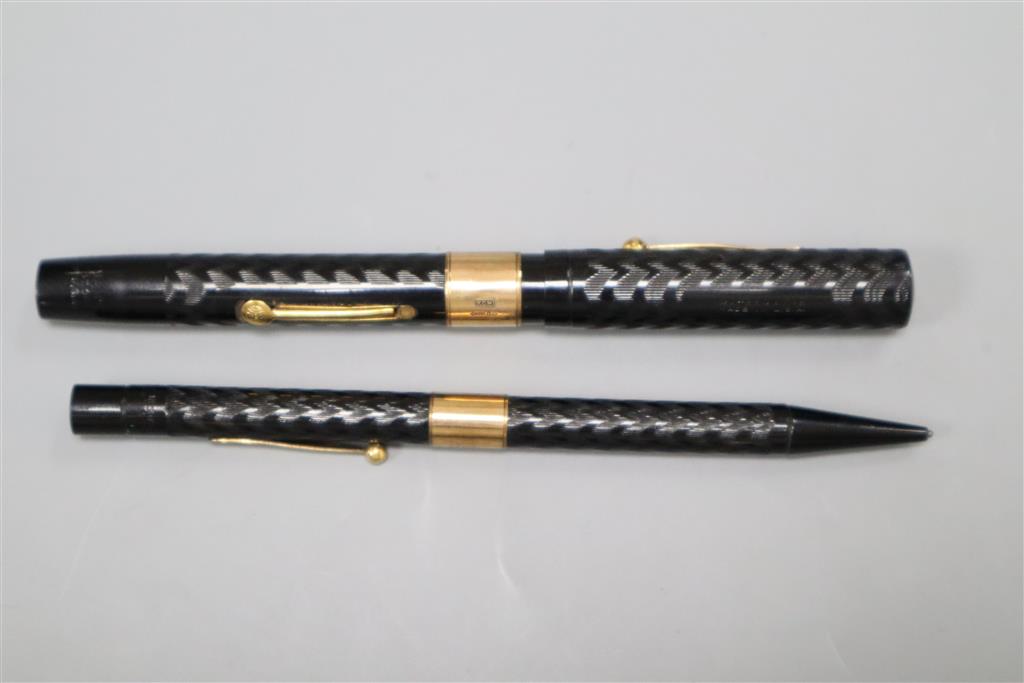 A 9ct gold mounted Watermans fountain pen together with a similar pencil